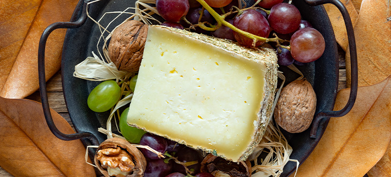 Pecorino cheese on a plate with garnish